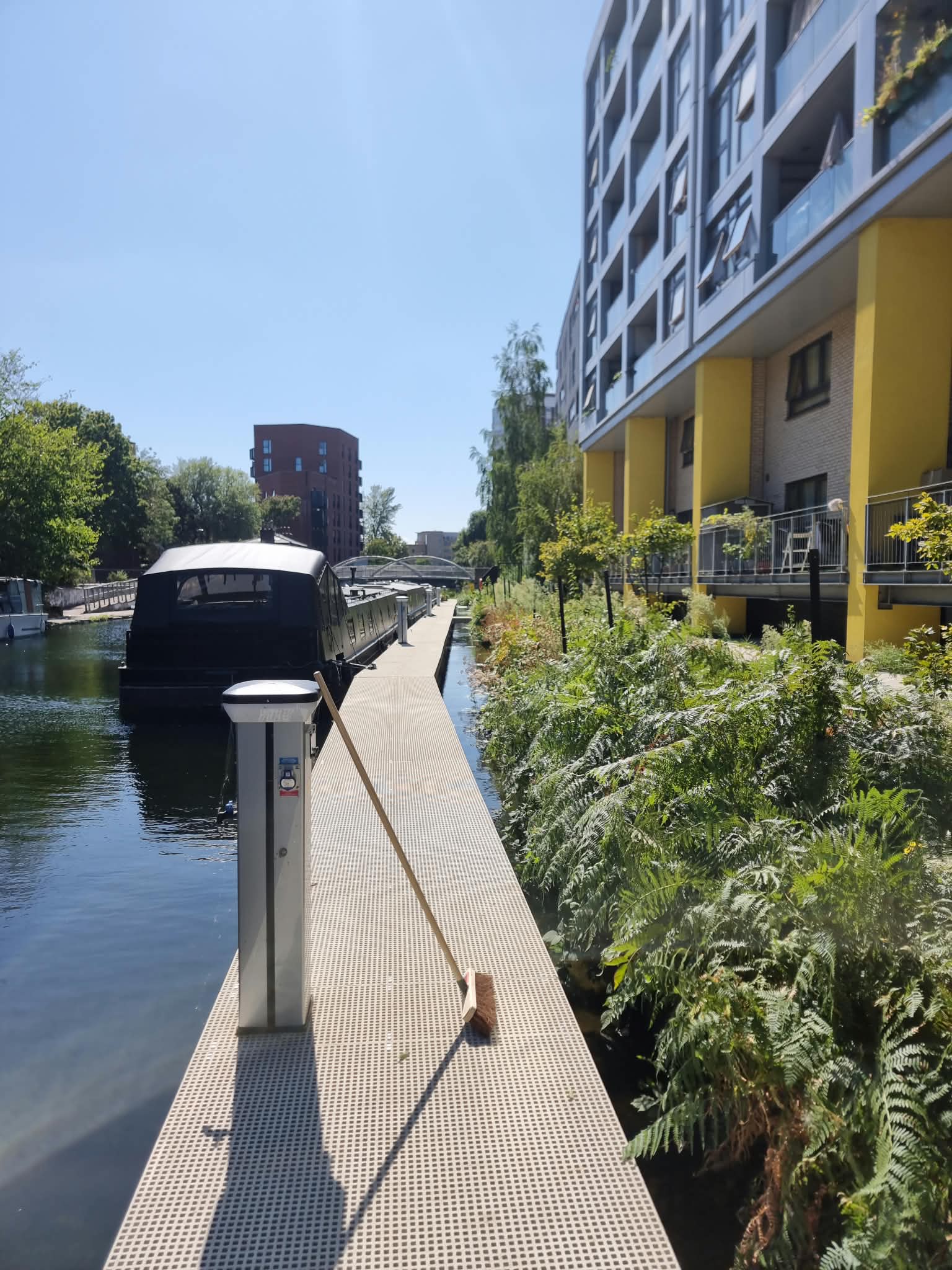Elizabeth Wharf walkway with power pedestal and planted bank